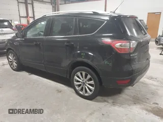 2017 Ford Escape Titanium with VIN 1FMCU9J9XHUB51401, listed as a IAAI auction lot 41025642 with 77,908 mi miles. Bid and sale history available at carsss.com. Image 3.