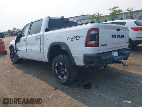 2022 Ram 1500 Rebel with VIN 1C6SRFLT5NN318494, listed as a IAAI auction lot 42413194 with 59,458 mi miles and . Bid and sale history available at DreamBid. Image 3.