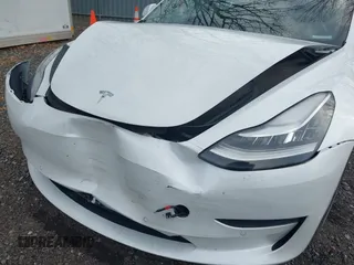 2020 Tesla Model 3 Long Range with VIN 5YJ3E1EB6LF618931, listed as a IAAI auction lot 41867451 with 47,502 mi miles and . Bid and sale history available at DreamBid. Image 6.