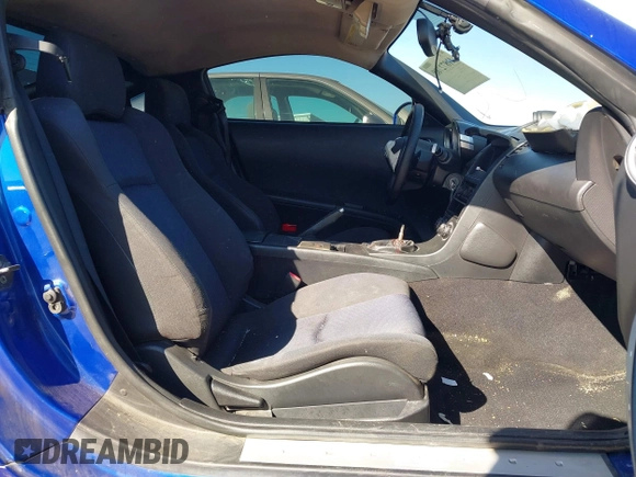 2004 Nissan 350Z Touring with VIN JN1AZ34D34T165329, listed as a IAAI auction lot 41872788 with 199,196 mi miles. Bid and sale history available at carsss.com. Image 5.