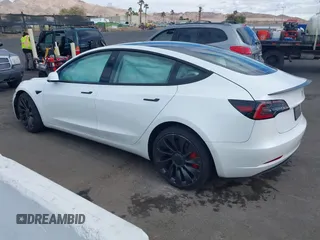 2022 Tesla Model 3 Performance with VIN 5YJ3E1EC6NF111958, listed as a IAAI auction lot 41583972 with 28,431 mi miles and . Bid and sale history available at DreamBid. Image 3.