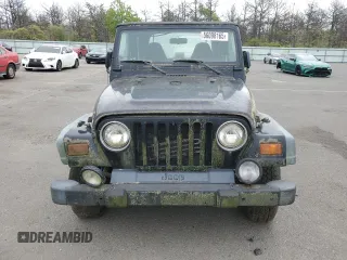 1999 Jeep Wrangler Sport z VIN 1J4FY19S2XP423722, wystawiony jako Copart lot #56098165 z przebiegiem 119 586 mil mil oraz Czysty tytuł • Clean title. Historia ofert i sprzedaży dostępna na DreamBid. Obrazek 5.