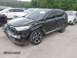 2017 Honda CR-V Touring with VIN 2HKRW2H96HH672017, listed as a IAAI auction lot 42151118 with 144,527 mi miles and . Bid and sale history available at carsss.com. Image 2.