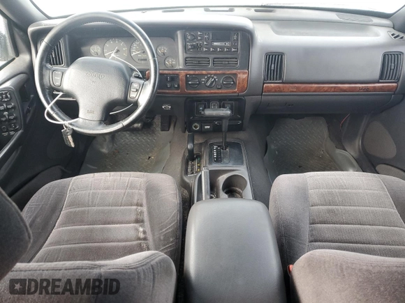 1997 Jeep Grand Cherokee Laredo with VIN 1J4GZ58Y6VC603370, listed as a Copart auction lot 82802794 with 0 mi miles and Salvage Title. Bid and sale history available at carsss.com. Image 8.
