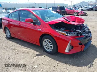 2021 Toyota Prius LE z VIN JTDKAMFP6M3192515, wystawiony jako IAAI lot #42302003 z przebiegiem 74 247 mil mil oraz . Historia ofert i sprzedaży dostępna na DreamBid. Obrazek 1.