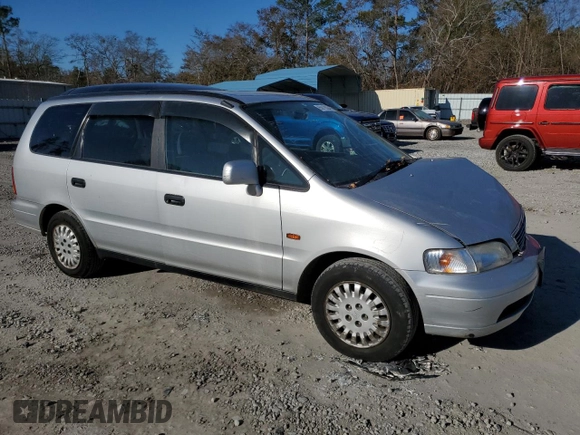 1997 Honda Odyssey with VIN RA11239041, listed as a Copart auction lot 85819024 with 79,952 mi miles and Salvage title. Bid and sale history available at DreamBid. Image 4.