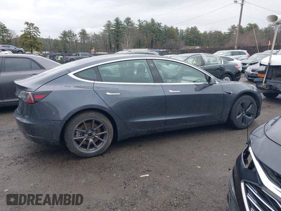 2019 Tesla Model 3 Mid Range with VIN 5YJ3E1EA3KF307415, listed as a IAAI auction lot 41673239 with 42,895 mi miles and . Bid and sale history available at DreamBid. Image 13.