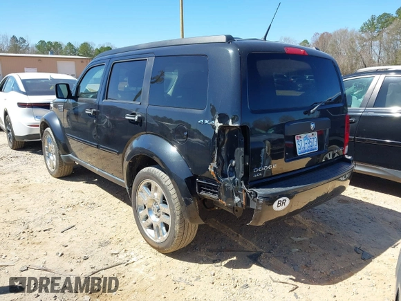 2011 Dodge Nitro Heat with VIN 1D4PU4GX7BW565927, listed as a IAAI auction lot 41803129 with 84,980 mi miles. Bid and sale history available at carsss.com. Image 3.