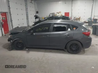 2018 Subaru Impreza with VIN 4S3GTAA65J3713216, listed as a IAAI auction lot 40963294 with 94,176 mi miles and . Bid and sale history available at DreamBid. Image 14.