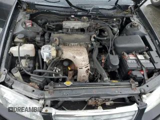 2000 Toyota Camry CE z VIN JT2BG22K7Y0479410, wystawiony jako Copart lot #57871825 z przebiegiem 222 941 mil mil oraz Tytuł czysty. Historia ofert i sprzedaży dostępna na DreamBid. Obrazek 11.