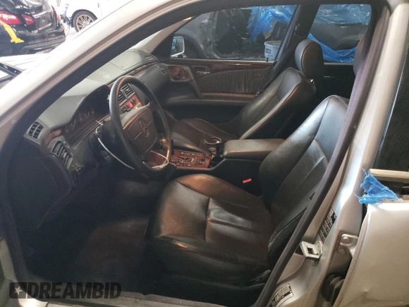 1999 Mercedes-Benz E-Class with VIN WDBJF82H4XX021888, listed as a Copart auction lot 83069274 with 173,198 mi miles and Salvage Title. Bid and sale history available at carsss.com. Image 7.