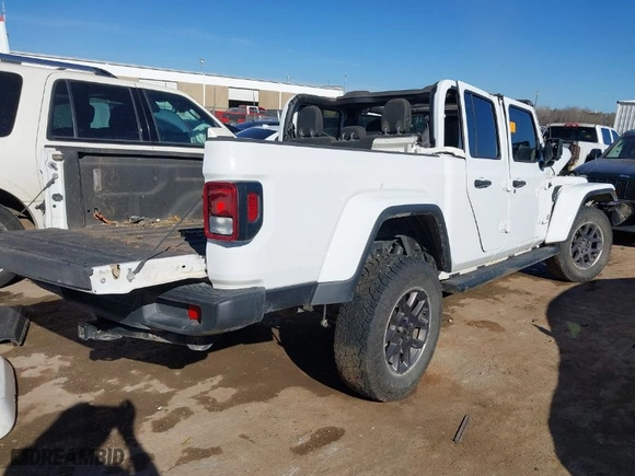 2022 Jeep Gladiator Overland with VIN 1C6HJTFGXNL142438, listed as a IAAI auction lot 41442944 with 52,867 mi miles. Bid and sale history available at carsss.com. Image 4.