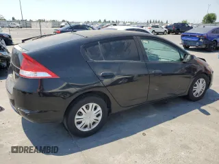 2010 Honda Insight LX with VIN JHMZE2H59AS041185, listed as a Copart auction lot 64517415 with 208,242 mi miles and Salvage title. Bid and sale history available at DreamBid. Image 3.