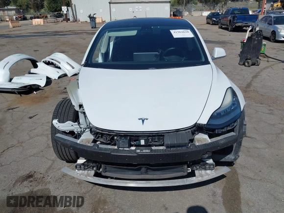 2018 Tesla Model 3 Long Range Battery with VIN 5YJ3E1EAXJF108781, listed as a IAAI auction lot 41962628 with 61,208 mi miles and . Bid and sale history available at DreamBid. Image 13.