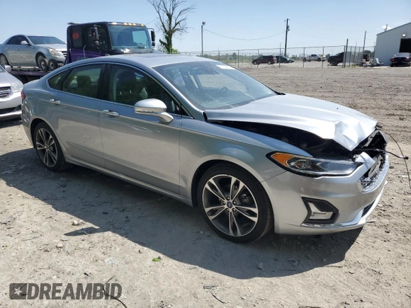 2020 Ford Fusion Titanium with VIN 3FA6P0D93LR180244, listed as a Copart auction lot 57102055 with 34,868 mi miles and Salvage title. Bid and sale history available at DreamBid. Image 4.