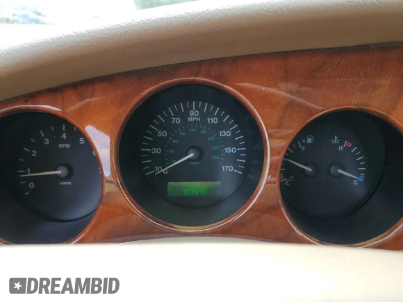 1999 Jaguar XK z VIN SAJGX2044XC031383, wystawiony jako Copart lot #54726925 z przebiegiem 107 696 mil mil oraz Szkody całkowita. Historia ofert i sprzedaży dostępna na DreamBid. Obrazek 9.