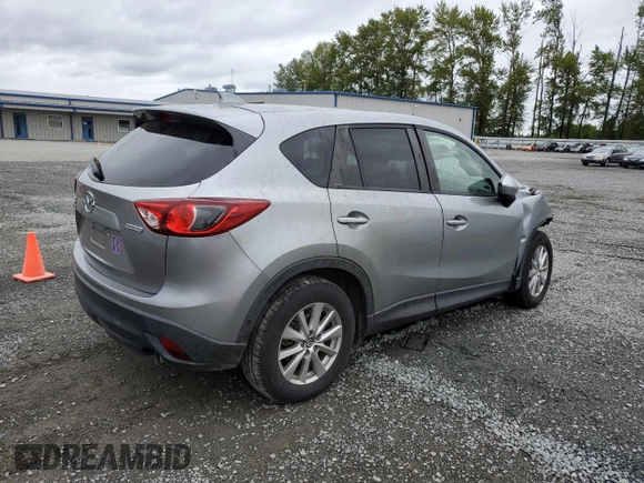 2014 Mazda CX-5 Touring z VIN JM3KE4CYXE0426408, wystawiony jako Copart lot #57355115 z przebiegiem Nie podano mil oraz Szkody całkowita. Historia ofert i sprzedaży dostępna na DreamBid. Obrazek 3.