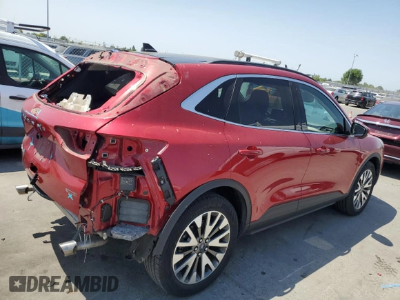 2020 Ford Escape Titanium with VIN 1FMCU9J98LUA58109, listed as a Copart auction lot 59397735 with 31,334 mi miles and Salvage title. Bid and sale history available at DreamBid. Image 3.