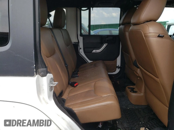 2013 Jeep Wrangler Unlimited Sahara with VIN 1C4HJWEG9DL628684, listed as a Copart auction lot 57672175 with 69,010 mi miles and Salvage title. Bid and sale history available at DreamBid. Image 11.