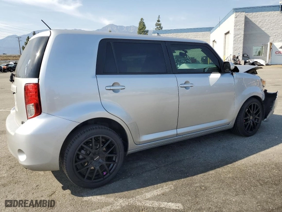 2012 Scion xB with VIN JTLZE4FE3C1143496, listed as a Copart auction lot 52157215 with 223,376 mi miles and Salvage Title. Bid and sale history available at carsss.com. Image 3.