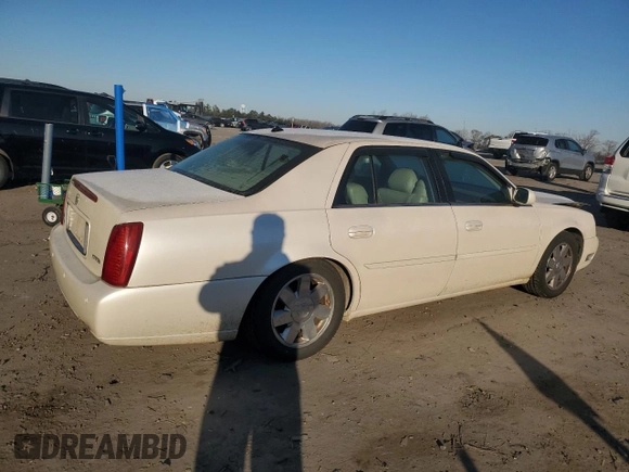 2003 Cadillac DeVille DTS z VIN 1G6KF57963U257494, wystawiony jako Copart lot #84532944 z przebiegiem 104 766 mil mil oraz Szkoda całkowita • Salvage title. Historia ofert i sprzedaży dostępna na DreamBid. Obrazek 3.