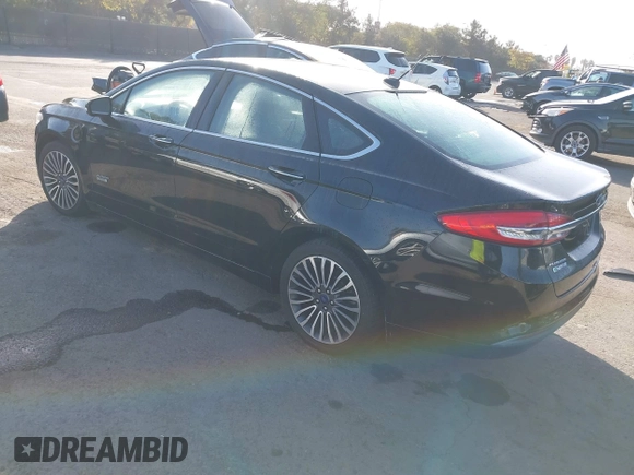 2017 Ford Fusion Energi SE with VIN 3FA6P0PU0HR129792, listed as a IAAI auction lot 41104376 with 86,659 mi miles. Bid and sale history available at carsss.com. Image 3.