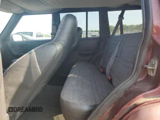 2000 Jeep Cherokee z VIN 1J4FF48S2YL135037, wystawiony jako Copart lot #66156505 z przebiegiem 72 433 mil mil oraz Szkoda całkowita • Salvage title. Historia ofert i sprzedaży dostępna na DreamBid. Obrazek 10.