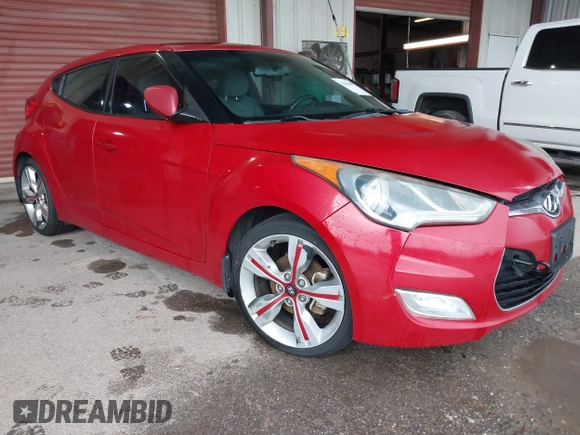 2014 Hyundai Veloster z VIN KMHTC6AD3EU201508, wystawiony jako IAAI lot #42353066 z przebiegiem 140 032 mil mil oraz . Historia ofert i sprzedaży dostępna na DreamBid. Obrazek 1.