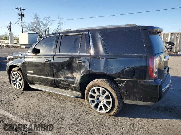 2018 GMC Yukon Denali with VIN 1GKS1CKJ0JR106589, listed as a Copart auction lot 79977034 with 98,022 mi miles and Salvage Title. Bid and sale history available at carsss.com. Image 2.