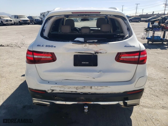 2019 Mercedes-Benz GLC with VIN WDC0G5EB0KF627620, listed as a Copart auction lot 77641154 with 73,741 mi miles and Salvage Title. Bid and sale history available at carsss.com. Image 6.