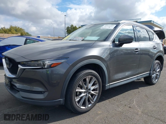 2021 Mazda CX-5 Grand Touring with VIN JM3KFADM2M1340669, listed as a IAAI auction lot 41916687 with 83,872 mi miles. Bid and sale history available at carsss.com. Image 20.