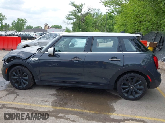2019 MINI Hardtop 4 Door Cooper S z VIN WMWXU3C54K2H86856, wystawiony jako IAAI lot #42201474 z przebiegiem 56 610 mil mil oraz . Historia ofert i sprzedaży dostępna na DreamBid. Obrazek 14.
