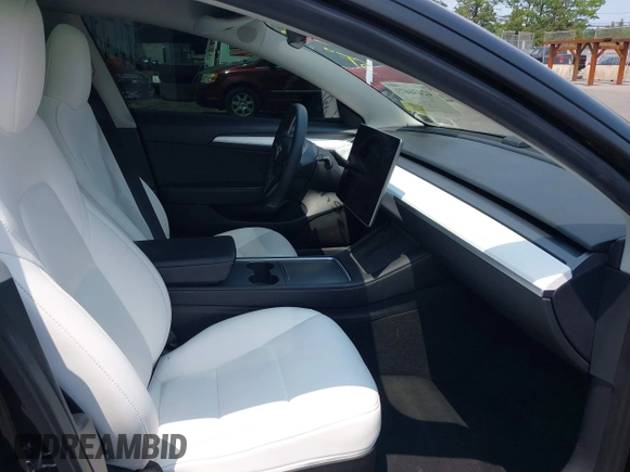 2023 Tesla Model 3 z VIN 5YJ3E1EA4PF565899, wystawiony jako IAAI lot #42436473 z przebiegiem 30 141 mil mil oraz . Historia ofert i sprzedaży dostępna na DreamBid. Obrazek 5.
