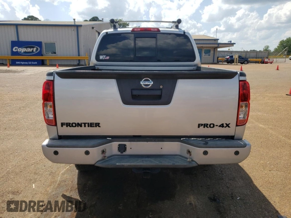2016 Nissan Frontier Pro-4X with VIN 1N6AD0EV0GN797437, listed as a Copart auction lot 54203245 with 131,021 mi miles and Salvage title. Bid and sale history available at DreamBid. Image 6.