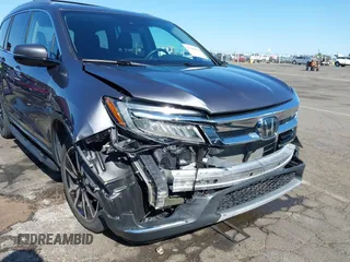 2021 Honda Pilot Touring 8-Passenger with VIN 5FNYF6H97MB034399, listed as a IAAI auction lot 42303419 with 50,034 mi miles and . Bid and sale history available at DreamBid. Image 6.
