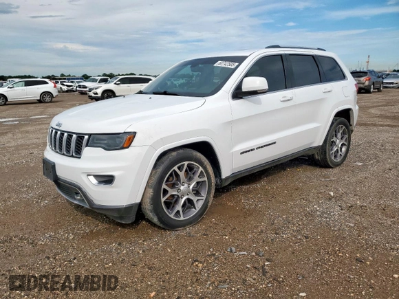 2018 Jeep Grand Cherokee Sterling z VIN 1C4RJEBG4JC322703, wystawiony jako Copart lot #60742505 z przebiegiem 110 621 mil mil oraz Szkoda całkowita • Salvage title. Historia ofert i sprzedaży dostępna na DreamBid. Obrazek 1.