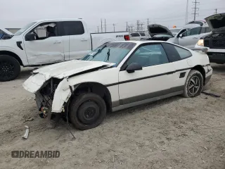 1986 Pontiac Fiero z VIN 1G2PG9796GP283609, wystawiony jako Copart lot #79048574 z przebiegiem 211 447 mil mil oraz Szkody całkowita. Historia ofert i sprzedaży dostępna na DreamBid. Obrazek 1.