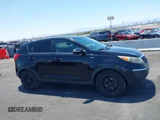 2013 Kia Sportage LX with VIN KNDPBCA25D7449584, listed as a IAAI auction lot 42489414 with 100,993 mi miles and . Bid and sale history available at DreamBid. Image 13.