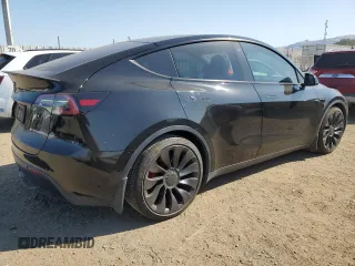 2022 Tesla Model Y Performance with VIN 7SAYGDEF1NF486218, listed as a Copart auction lot 63127435 with 99,302 mi miles and Salvage title. Bid and sale history available at DreamBid. Image 3.