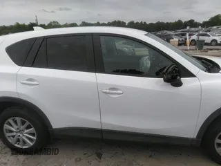 2014 Mazda CX-5 Touring z VIN JM3KE4CY0E0303748, wystawiony jako IAAI lot #42127406 z przebiegiem Nie podano mil oraz . Historia ofert i sprzedaży dostępna na DreamBid. Obrazek 12.