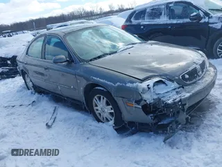 2004 Mercury Sable LS Premium with VIN 1MEFM55S04A619587, listed as a IAAI auction lot 41571950 with 125,444 mi miles. Bid and sale history available at carsss.com. Image 1.