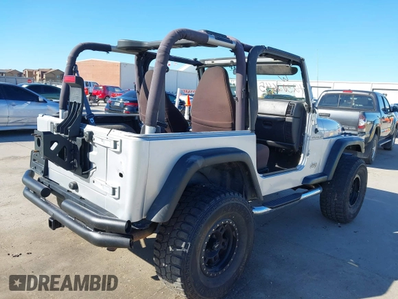 2002 Jeep Wrangler X with VIN 1J4FA39S42P763835, listed as a IAAI auction lot 42302645 with 233,634 mi miles and . Bid and sale history available at DreamBid. Image 4.