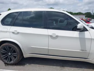 2012 BMW X5 35i z VIN 5UXZV4C55CL754164, wystawiony jako IAAI lot #42131605 z przebiegiem 147 177 mil mil oraz . Historia ofert i sprzedaży dostępna na DreamBid. Obrazek 13.
