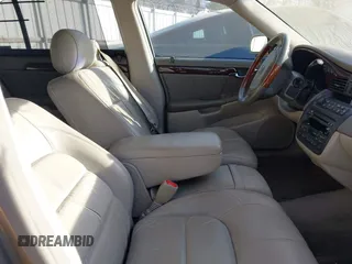 2002 Cadillac DeVille DHS z VIN 1G6KE57Y22U225134, wystawiony jako IAAI lot #41350531 z przebiegiem 126 457 mil mil oraz . Historia ofert i sprzedaży dostępna na DreamBid. Obrazek 5.