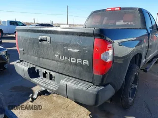 2014 Toyota Tundra 4WD Truck SR with VIN 5TFUM5F17EX051674, listed as a IAAI auction lot 41296906 with 140,782 mi miles. Bid and sale history available at carsss.com. Image 16.
