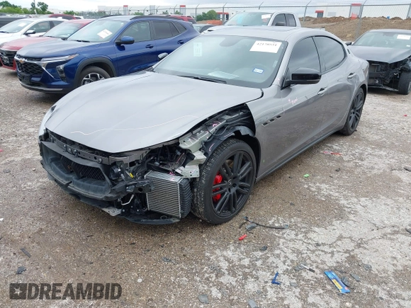 2021 Maserati Ghibli S Q4 with VIN ZAM57YTA8M1368703, listed as a IAAI auction lot 42170551 with 29,969 mi miles and . Bid and sale history available at DreamBid. Image 2.