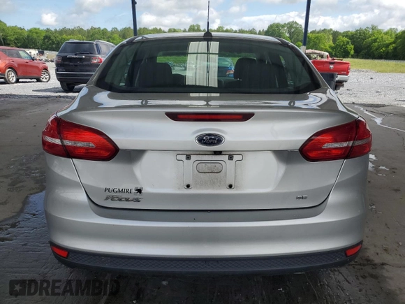 2018 Ford Focus SE z VIN 1FADP3F25JL265168, wystawiony jako Copart lot #56541895 z przebiegiem Nie podano mil oraz Szkoda całkowita • Salvage title. Historia ofert i sprzedaży dostępna na DreamBid. Obrazek 6.