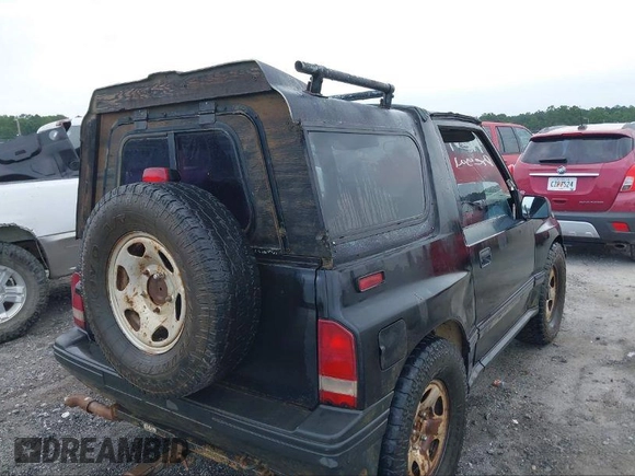 1995 Geo Tracker z VIN 2CNBE18U0S6943292, wystawiony jako IAAI lot #41274067 z przebiegiem Nie podano mil oraz . Historia ofert i sprzedaży dostępna na DreamBid. Obrazek 4.