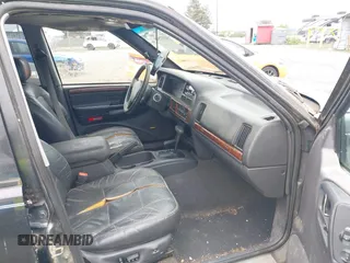 1998 Jeep Grand Cherokee Limited with VIN 1J4GZ78YXWC141912, listed as a IAAI auction lot 41972948 with 291,801 mi miles. Bid and sale history available at carsss.com. Image 5.