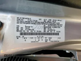 2013 Ford Focus SE with VIN 1FADP3F22DL263124, listed as a Copart auction lot 61583795 with 133,522 mi miles and Salvage title. Bid and sale history available at DreamBid. Image 12.